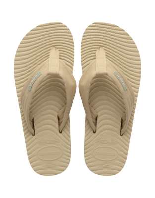  surfer coast flip flops in sand