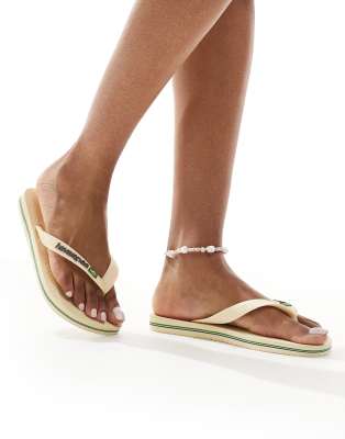 Havaianas - Zehenstegsandalen in Buttercremeweiß mit brasilianischem Logo-Neutral