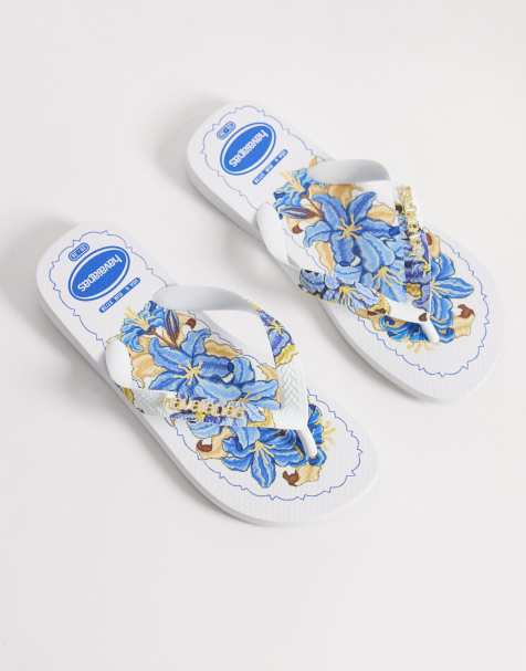 Havaianas – Zehenstegsandalen in Weiß mit tropischem Muster - view 1