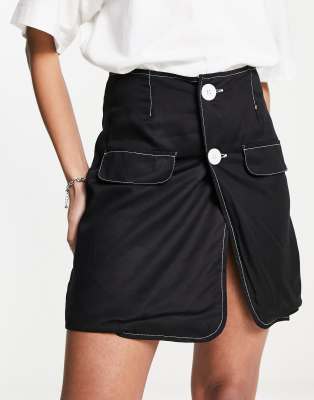 Heartbreak button front mini skirt with contrast stitch in black