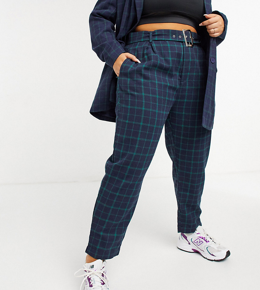 Plus-size trousers by Heartbreak You choose the occasion Check design High rise Belted waist Zip fly Side pockets Relaxed, tapered fit Cut loosely around the thigh with a narrow shape through the leg