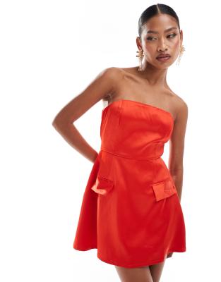 exclusive premium structured bandeau satin pocket detail mini dress in red