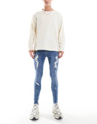 Hera Mens spray on ripped jean in mid blue