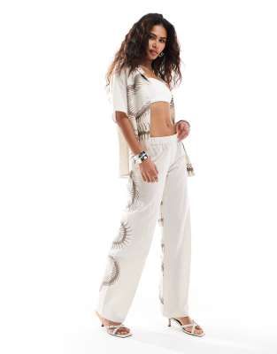 Heretic Nine Exclusive low rise straight leg trousers with fossil embroidery co-ord-Neutral