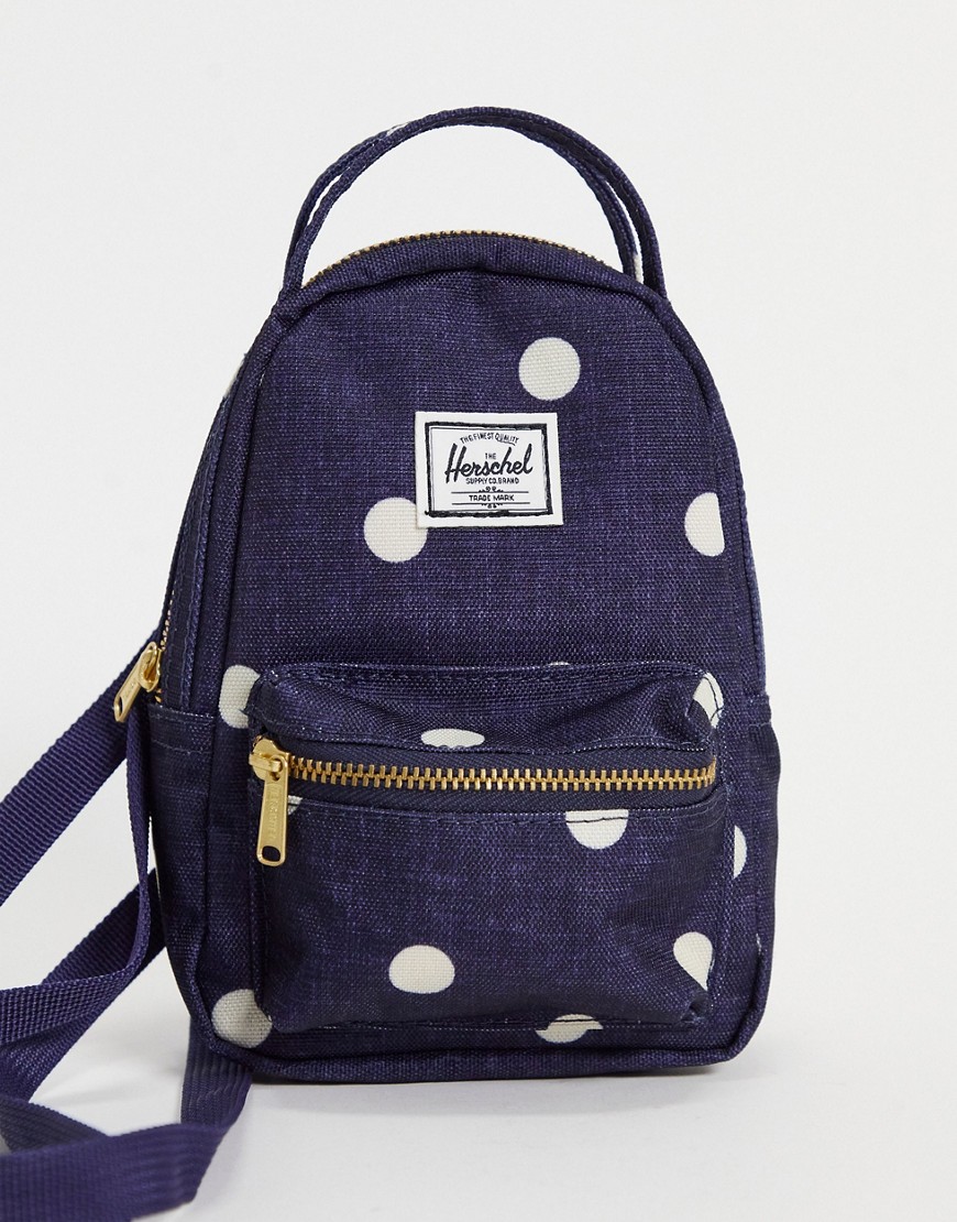 Herschel mini backpack in denim blue with white polka dots and cross body strap-Blues
