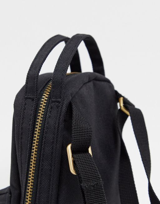 Herschel Nova crossbody mini backpack in black, ASOS