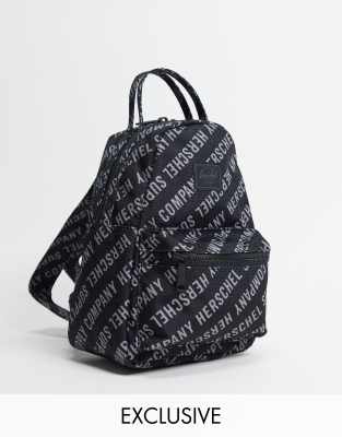 Herschel Supply Co Exclusive Nova mini backpack with all-over logo print in black