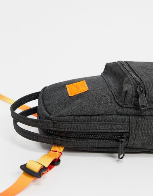 Herschel Nova crossbody mini backpack in black, ASOS