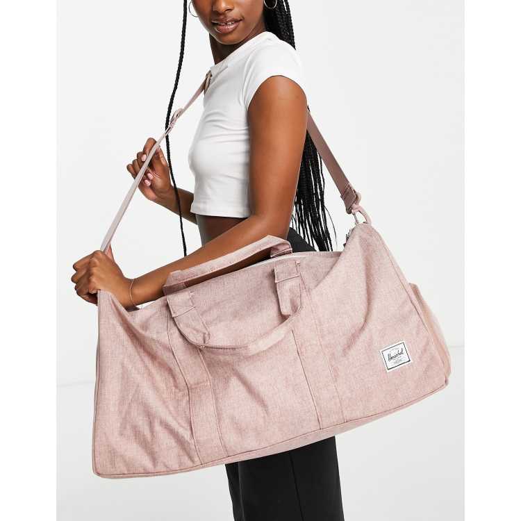 Herschel pink best sale duffle bag