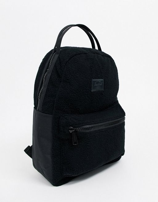 Herschel Nova crossbody mini backpack in black, ASOS