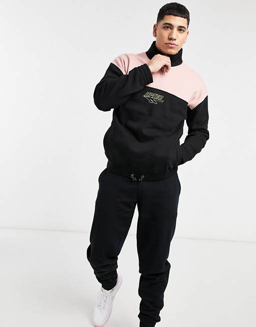 Hi-Tec high neck half zip pullover jacket in black and pink