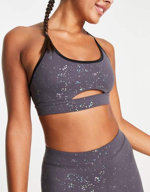 HIIT crop sports bra with cut out in holographic print