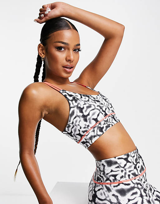 HIIT sports bra with strap detail in blurred animal print