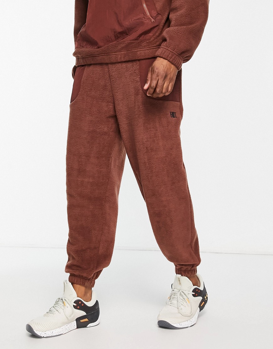 sweatpants in fleece with woven panels-Brown