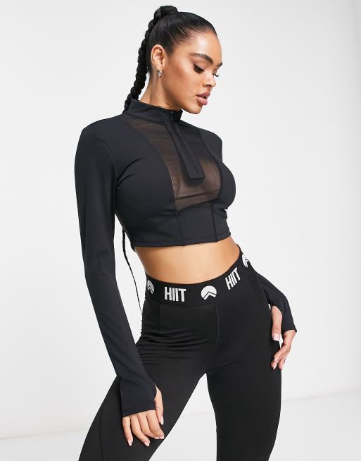 HIIT - Top met 1/2 ritsje en contourvlakken van mesh in zwart