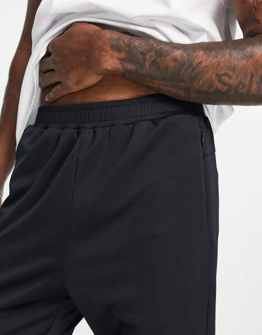 Nike Running Dri-FIT sweatpants in black