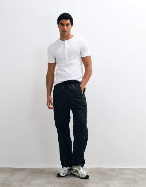 Hollister baggy side graphic track pants in black - view 1