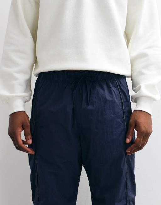 Hollister baggy side graphic track pants in navy, 4 of 5