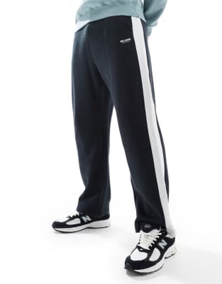 baggy varsity side stripe sweatpants in black