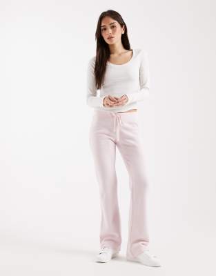 Hollister - Bootcut-Jogginghose in Babyrosa mit niedrigem Bund