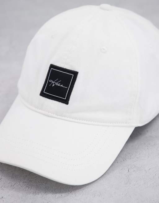 Hollister cap in white with text logo