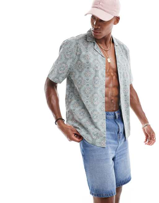 Hollister - Chemise coupe carrée à manches courtes et col cranté en popeline à imprimé géométrique - Bleu clair