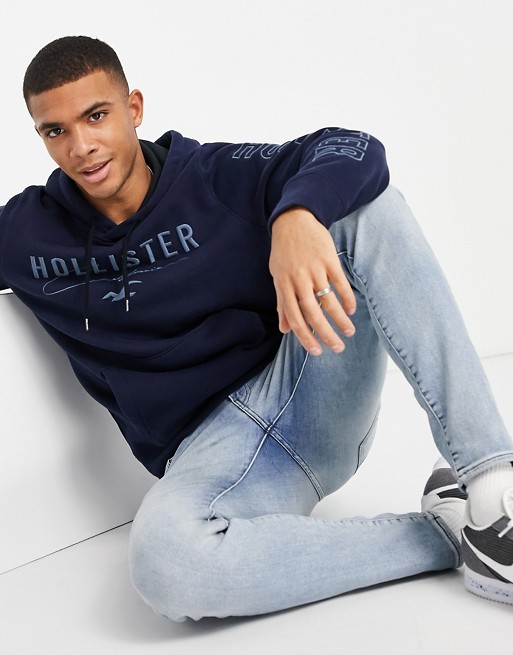 Hollister chest and sleeve script logo hoodie in navy
