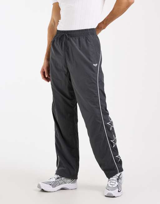 Hollister contrast piping baggy track bottoms in black, 2 of 5