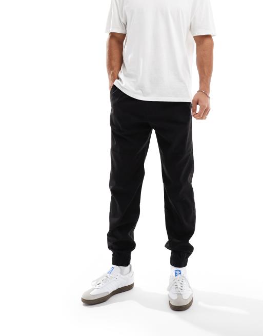 Hollister cuffed cotton nylon skinny joggers in black ASOS