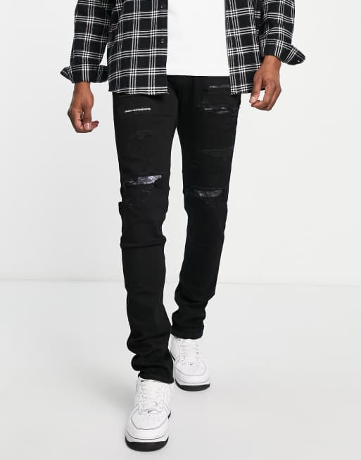 Hollister - Distressed skinny-fit jeans met reparatiepatch in zwart
