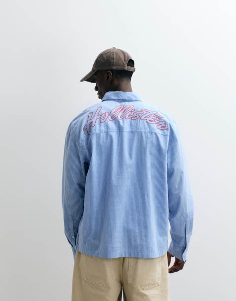 Hollister embroidered logo long sleeve poplin shirt in blue - view 1
