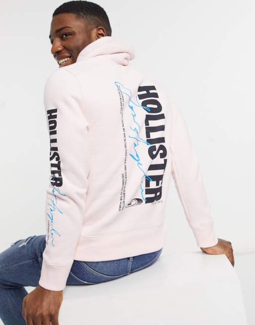 Hollister Felpa con cappuccio rosa con logo stampato fosforescente al buio sulla manica e sul retro