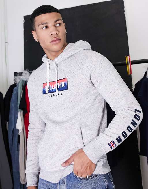 Hollister regular fit hoodie in grey with chest logo and sleeve taping  exclusive to ASOS, ASOS