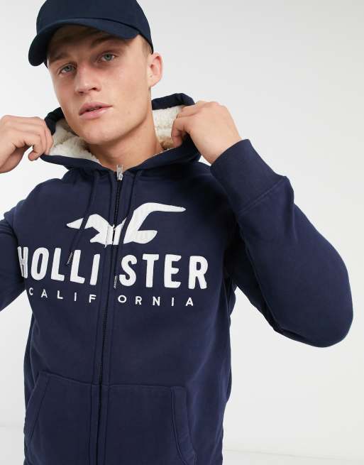 Hollister Logo Henley Long Sleeve Top in Navy, ASOS