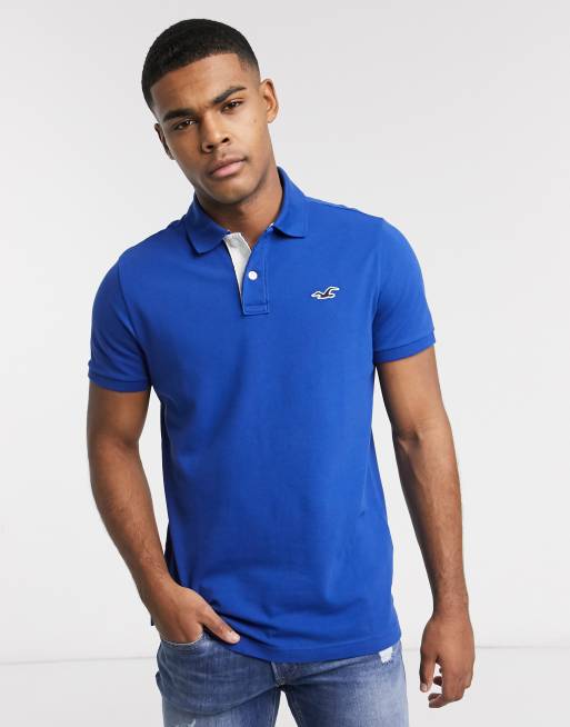 Hollister heritage icon logo heritage slim fit polo in blue | ASOS