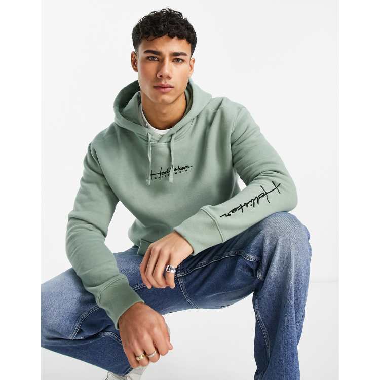 Hollister hoodie in green with script logo
