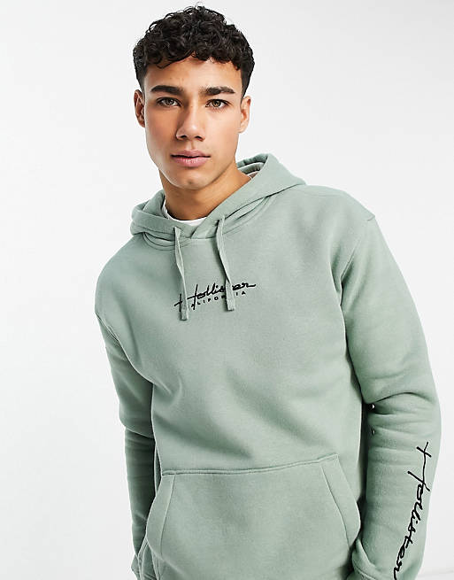 Hollister hoodie in green with script logo