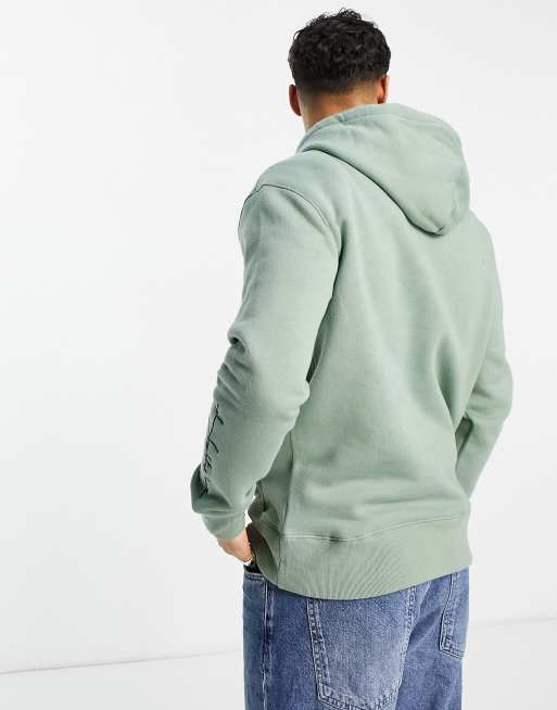 Hollister hoodie in green with script logo