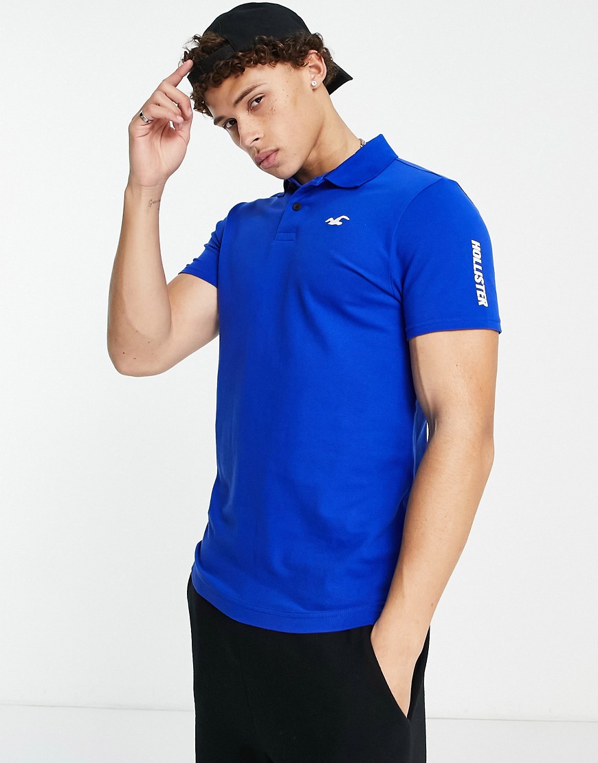 Hollister - Icon and Sport - Polo in piqué blu con logo sulle maniche polo uomo Blu