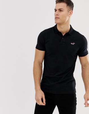 Hollister icon logo modern collar pique polo slim muscle fit in black ...