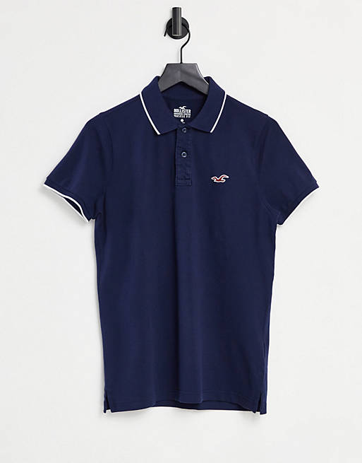 Hollister icon logo muscle fit tipped pique polo in navy | ASOS