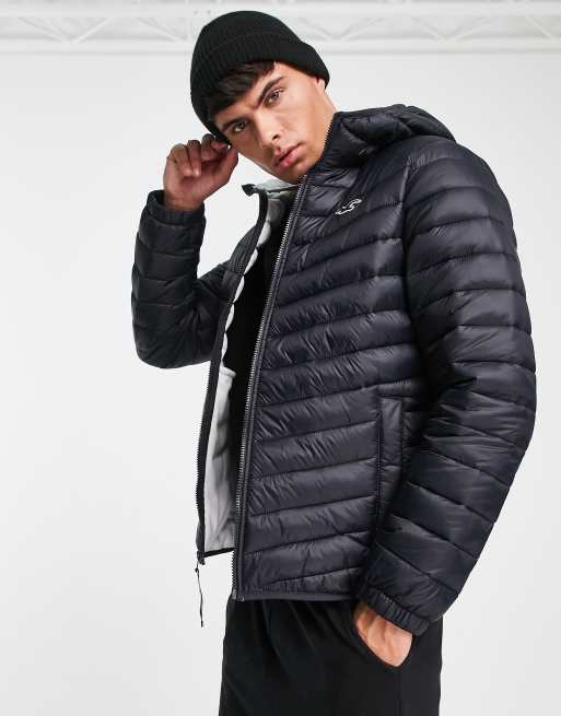 Hollister wide channel cozy hooded puffer jacket in black - ShopStyle