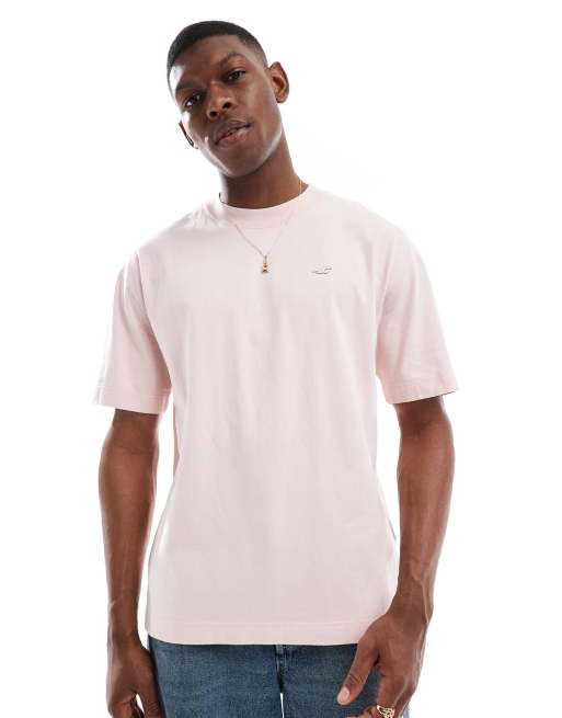 Hollister – Jasnoróżowy T-shirt o pudełkowym kroju 