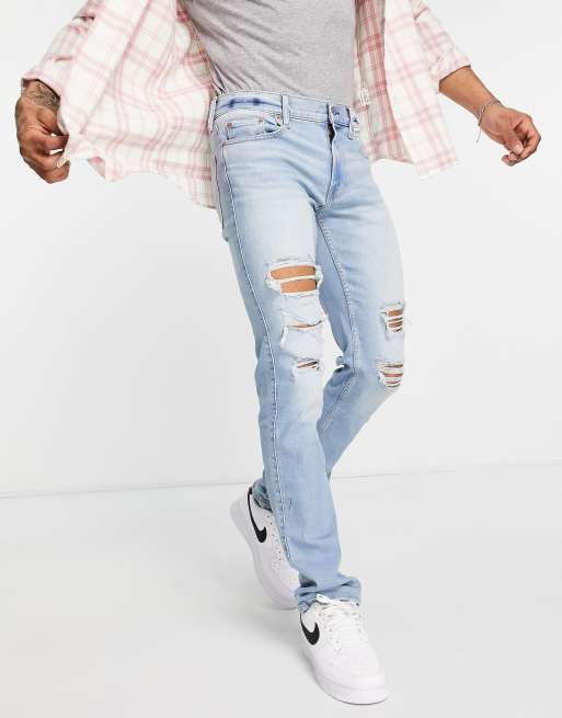 Hollister - Jean coupe slim à déchirures - Bleu clair délavé