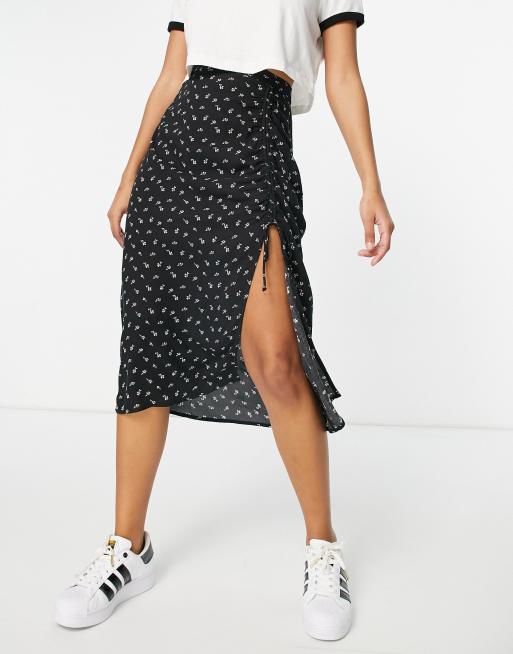 Hollister - Jupe mi-longue fendue à fleurs - Noir | ASOS