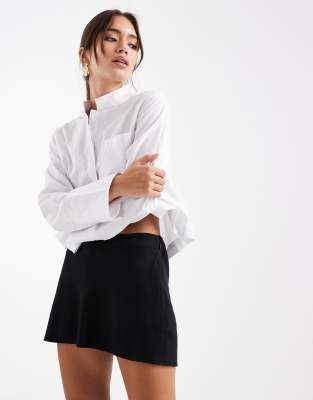 Hollister - Kurzer A-Linien-Rock in Schwarz mit hohem Bund und asymmetrischem Schnitt