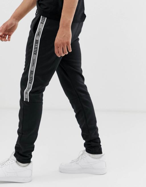 Hollister leg logo side piping cuffed joggers in black ASOS