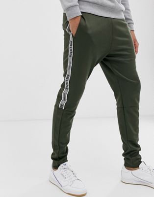 Hollister leg logo side piping cuffed sweatpants in olive