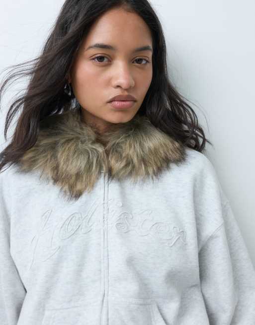 Hollister logo graphic zip through hoodie with fur trim in light grey, 1 of 5