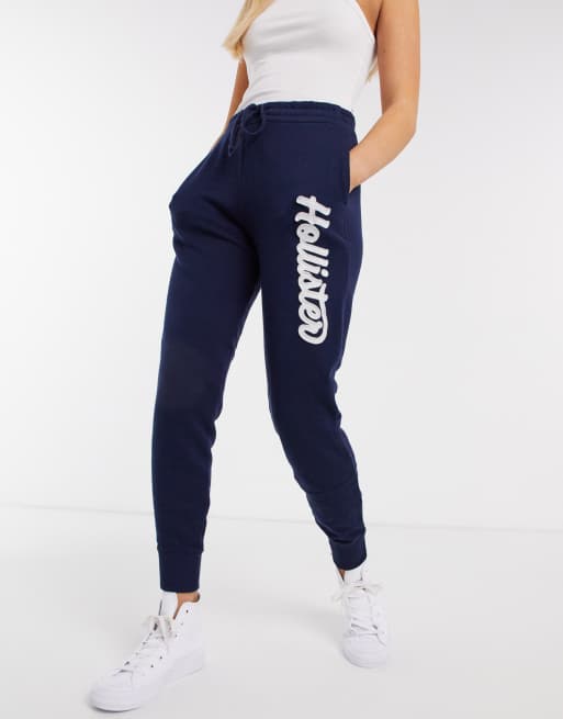 Hollister large iconic logo cuffed jogger in navy, ASOS